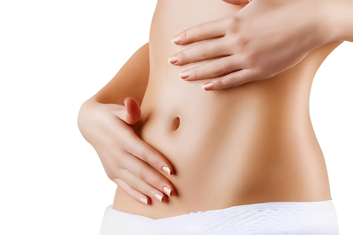 Female torso with hands on stomach