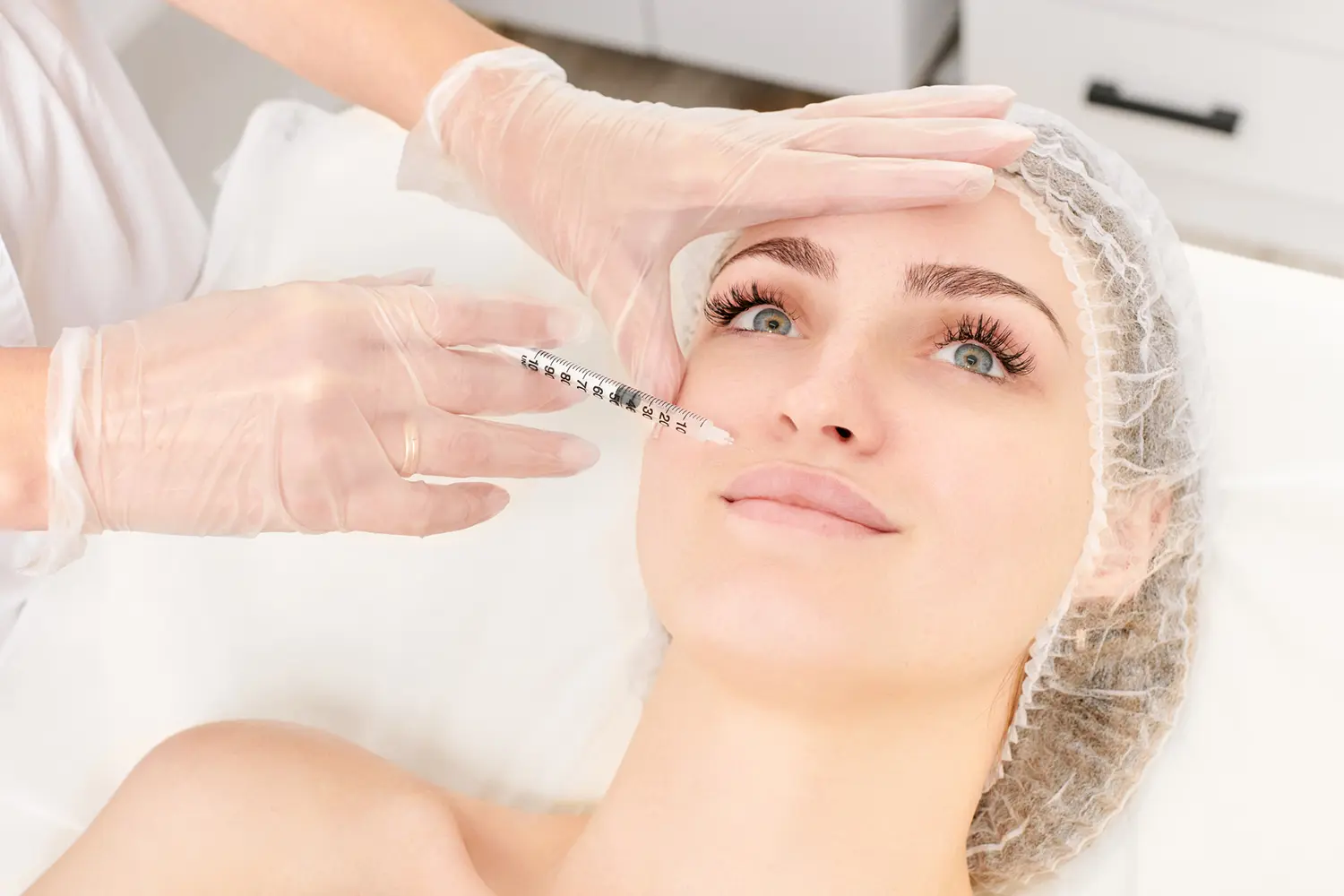 Doctor administering facial injectable treatment