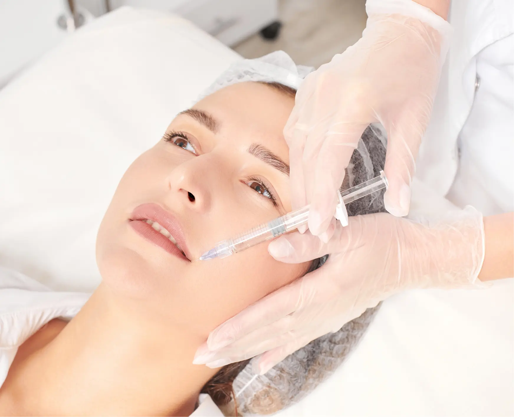 Woman receiving cosmetic injection in clinic
