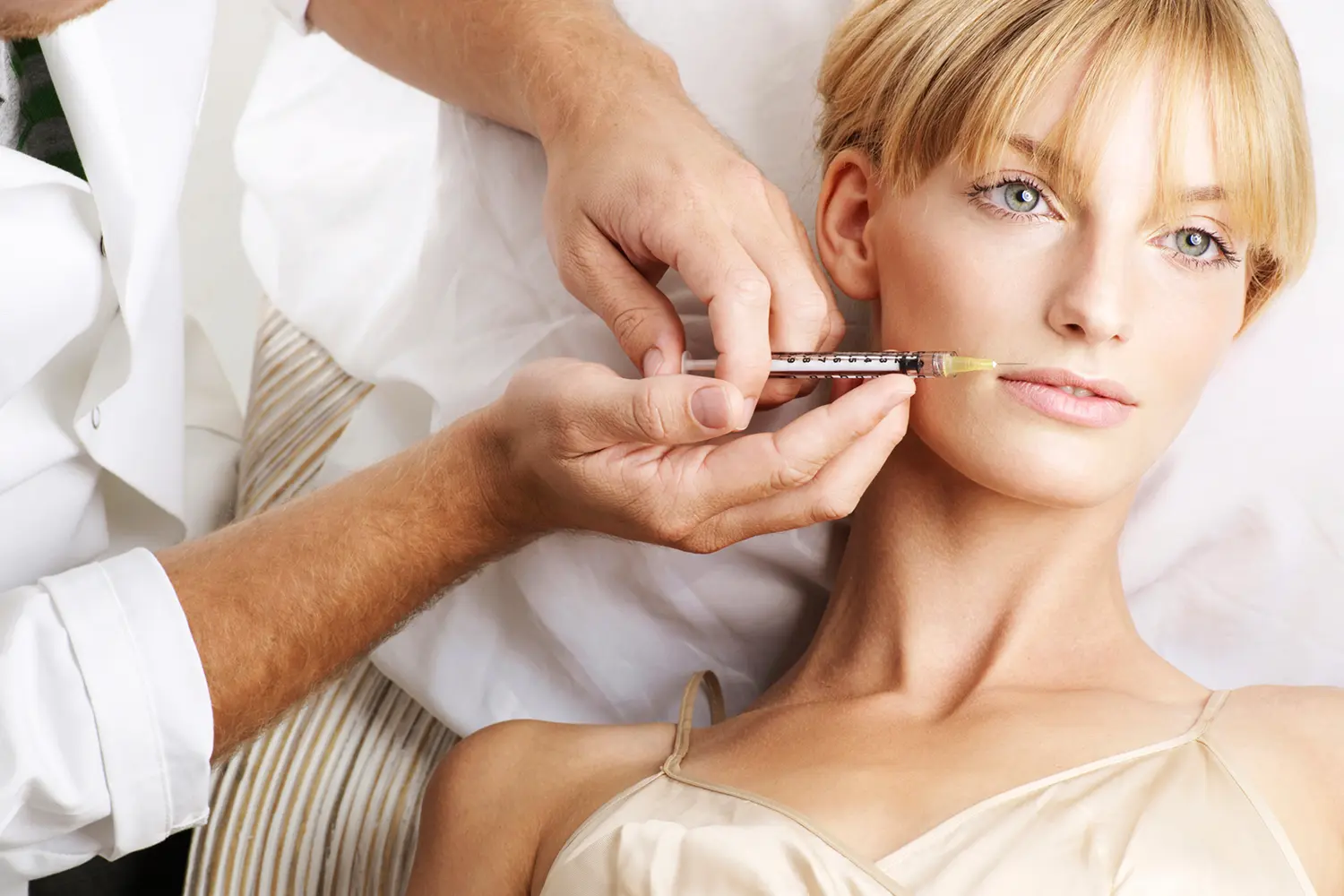 Cosmetic injection procedure on woman's lips