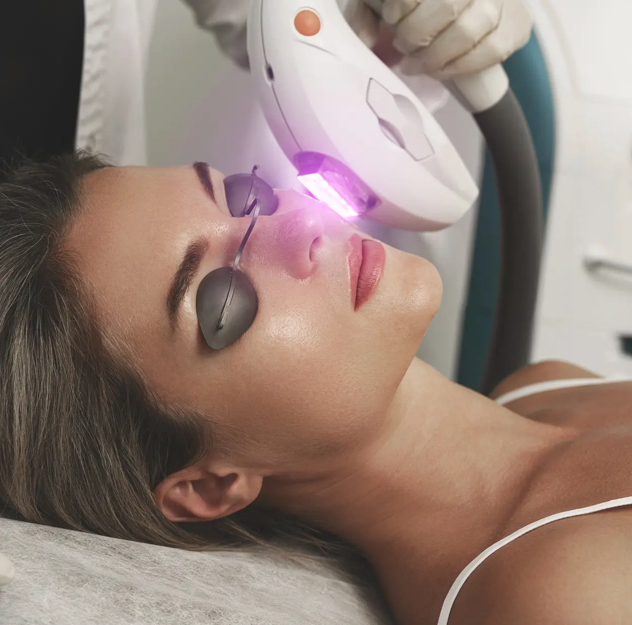 Woman receiving laser skin therapy