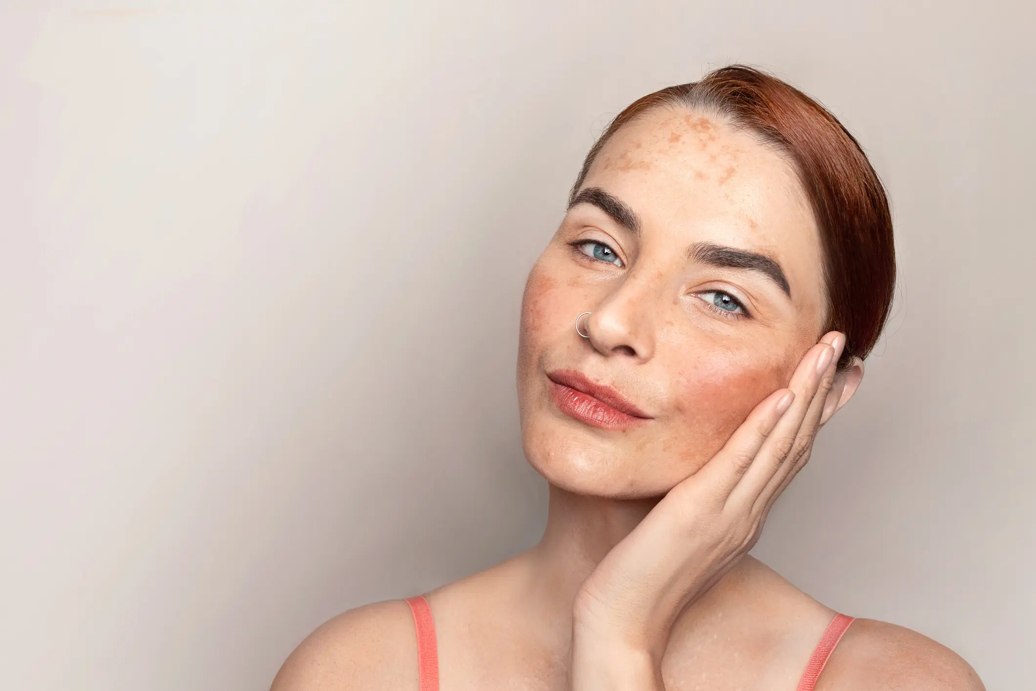 Confident woman with freckles and red hair