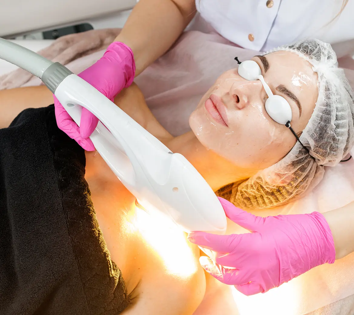Woman receiving laser treatment at spa