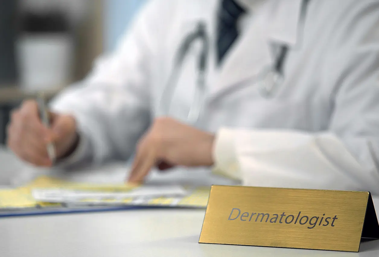 Doctor with dermatologist nameplate